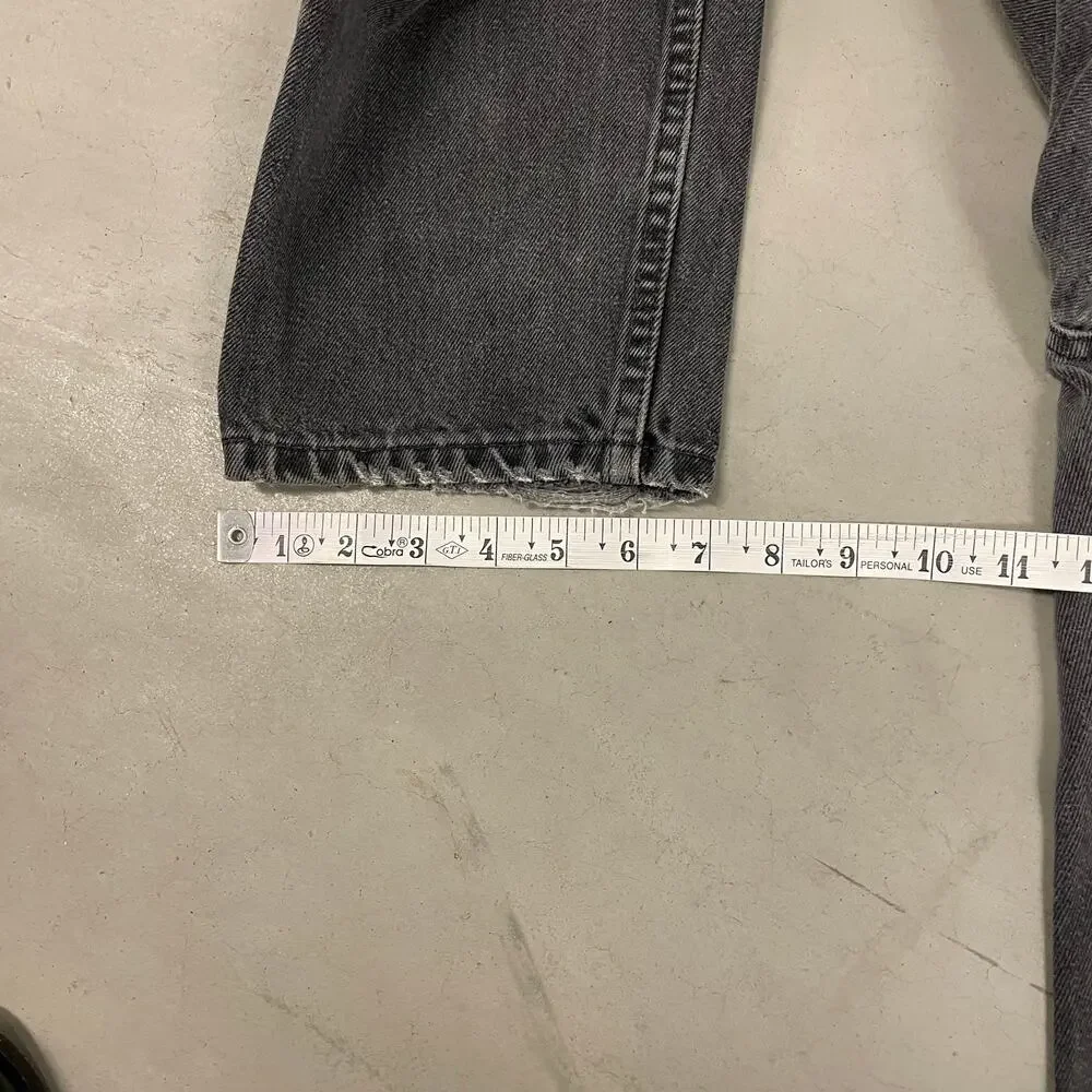 90s faded black Levi’s 550 paper tab jeans 32x33
